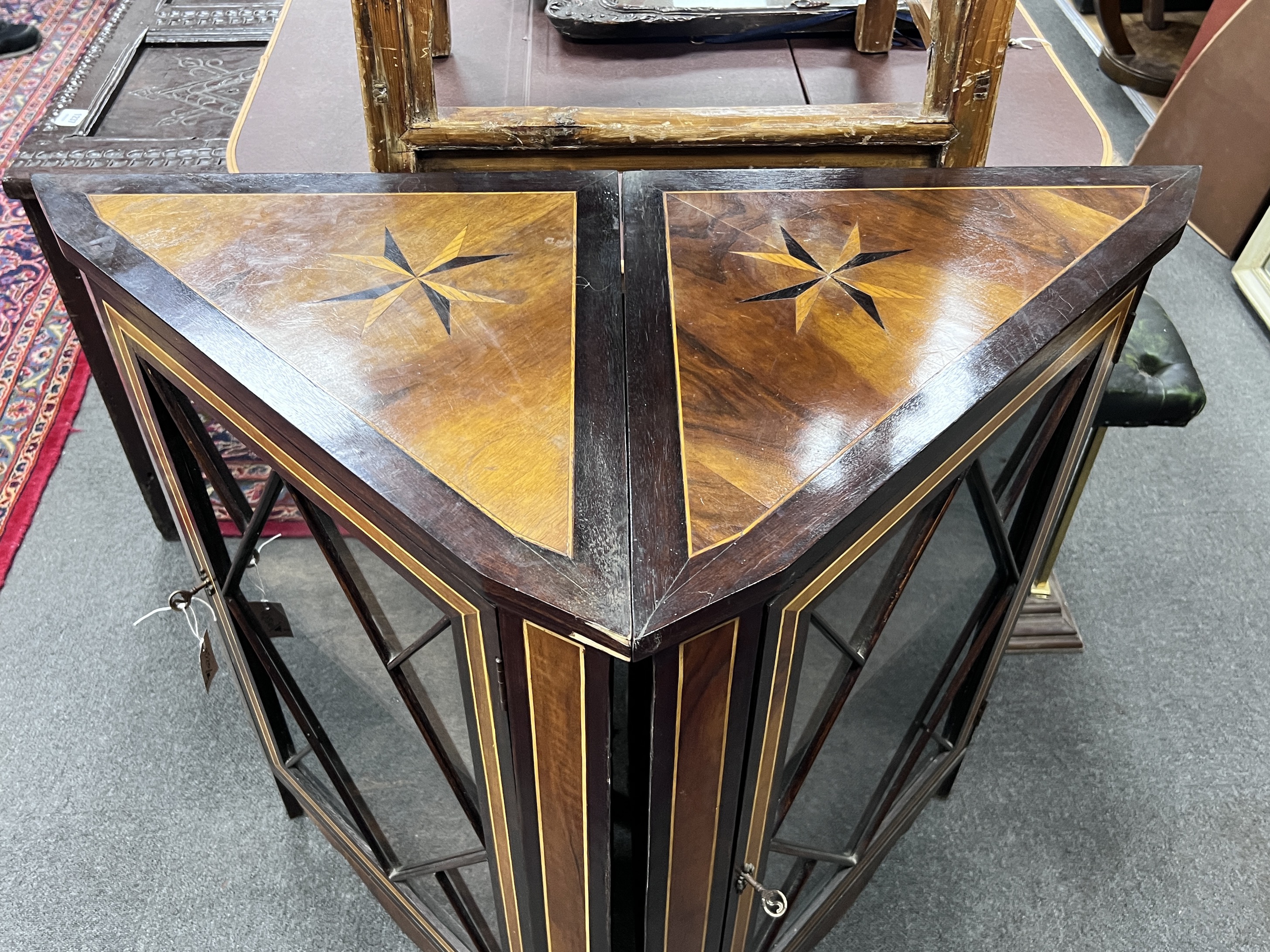 A pair of 19th century Dutch inlaid and stained beech corner cabinets, each set with a Maltese Cross to the top, width 67cm, height 92cm